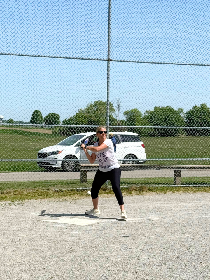Staff playing baseball.